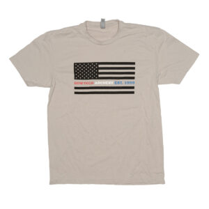 Light grey t-shirt with horizontal american flag and a line that has bowtech archery in red, white, and blue lettering